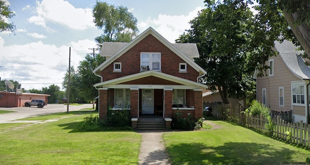 1727 17th Ave, Rockford, IL 61104 - view of front facade with brick siding and a porch
