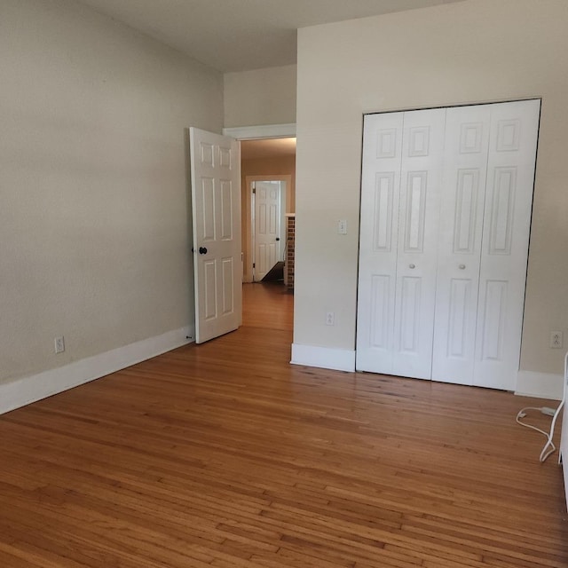 1223 Putnam St, Peru, IL 61354 - unfurnished bedroom featuring wood finished floors and a closet