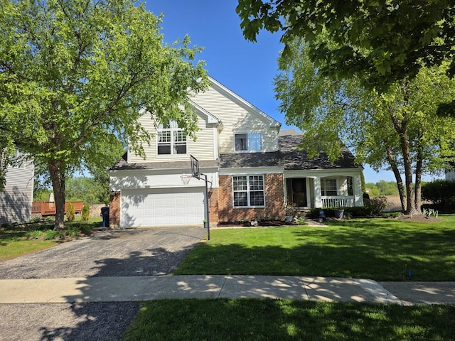 7943 Dada Dr, Gurnee, IL 60031 - view of front of home featuring driveway, brick siding, an attached garage, and a front lawn