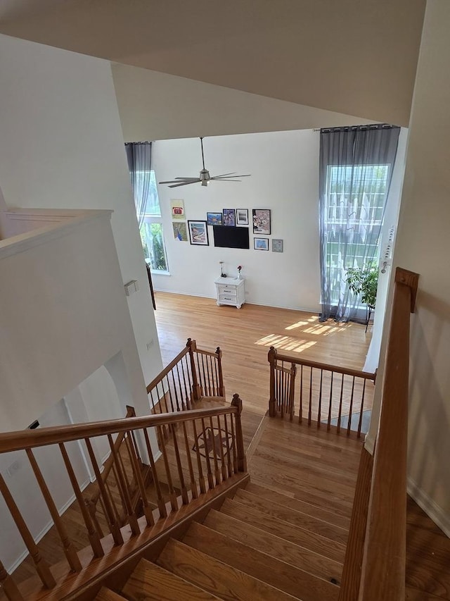 7943 Dada Dr, Gurnee, IL 60031 - stairway with wood finished floors, healthy amount of natural light, and a ceiling fan