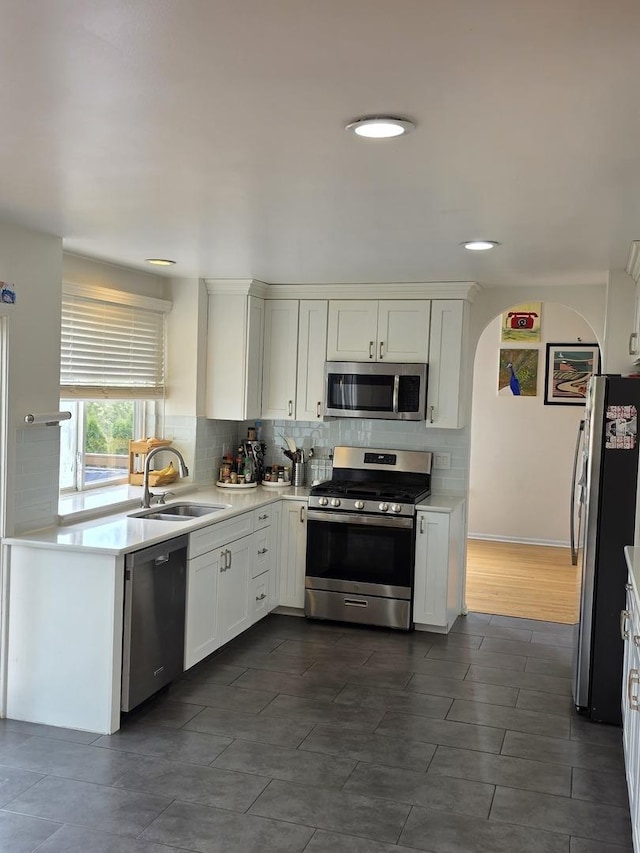 7943 Dada Dr, Gurnee, IL 60031 - kitchen with appliances with stainless steel finishes, backsplash, white cabinets, light countertops, and recessed lighting