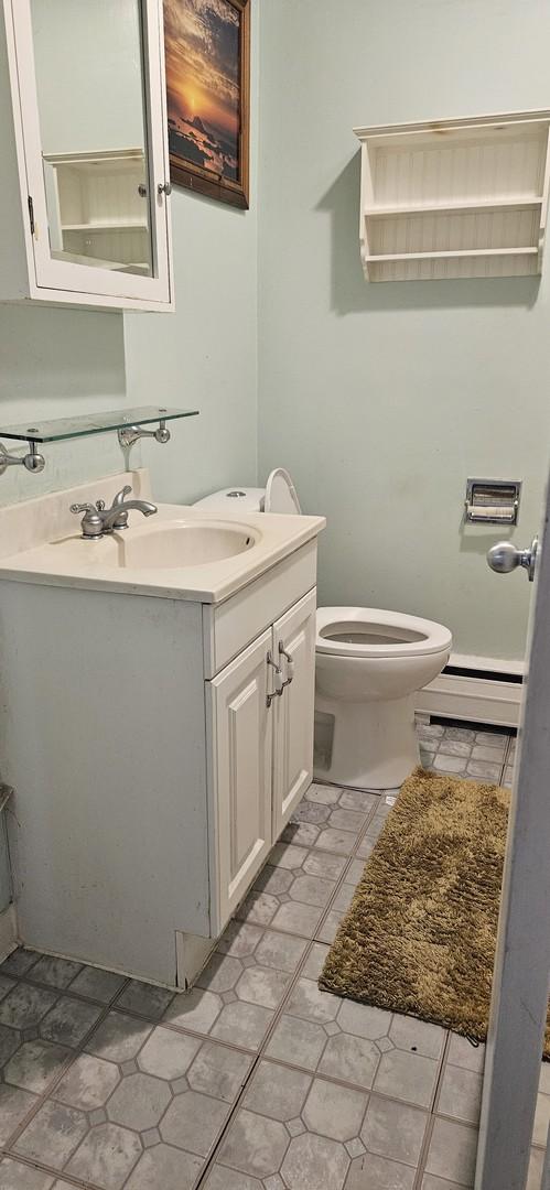 1541 Harlem Ave Unit 2S, Forest Park, IL 60130 - bathroom with baseboard heating and vanity
