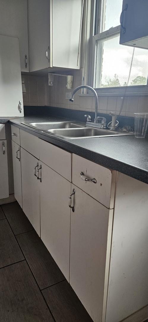 1541 Harlem Ave Unit 2S, Forest Park, IL 60130 - kitchen with white cabinets, dark countertops, and backsplash