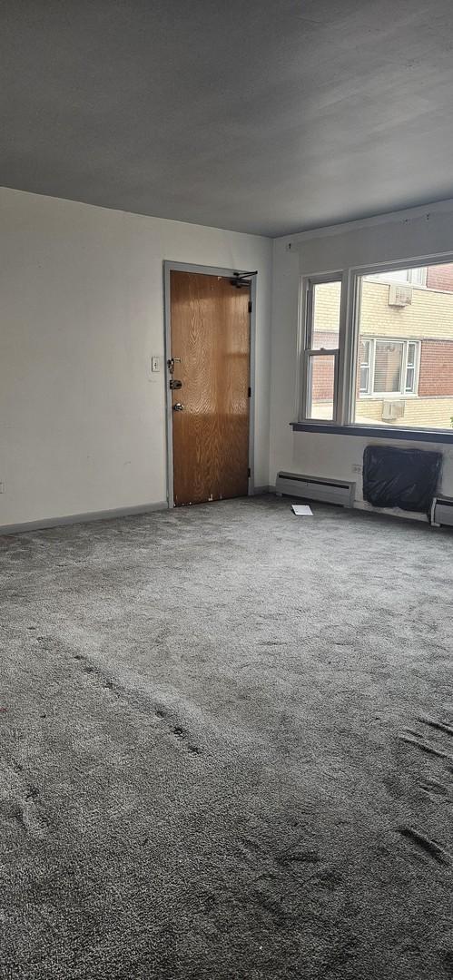 1541 Harlem Ave Unit 2S, Forest Park, IL 60130 - unfurnished room with carpet and baseboard heating
