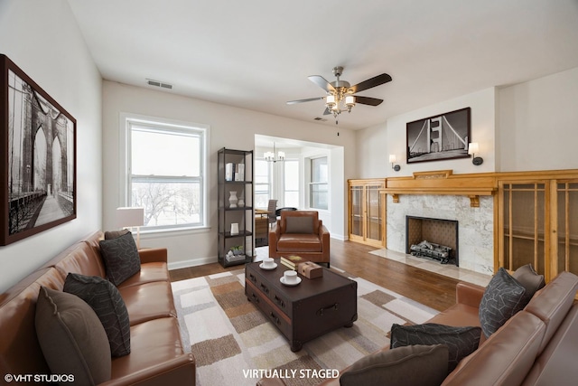 745 S Independence Blvd Unit 3N, Chicago, IL 60624 - living area featuring wood finished floors, ceiling fan, a high end fireplace, and a chandelier