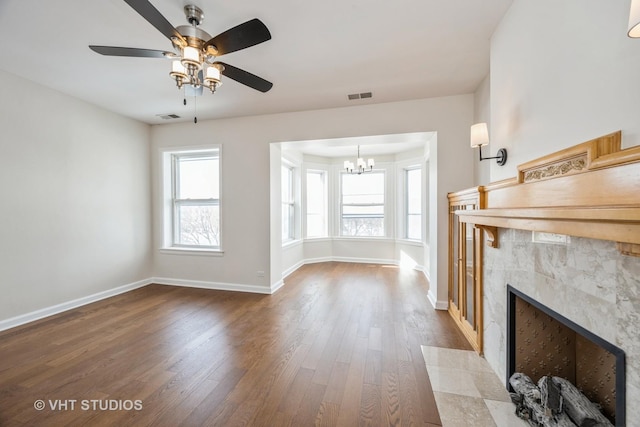 745 S Independence Blvd Unit 3N, Chicago, IL 60624 - unfurnished living room with dark wood finished floors, ceiling fan, a chandelier, and a tiled fireplace