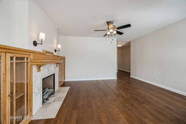 745 S Independence Blvd Unit 3N, Chicago, IL 60624 - unfurnished living room with a fireplace, a ceiling fan, and dark wood-style flooring