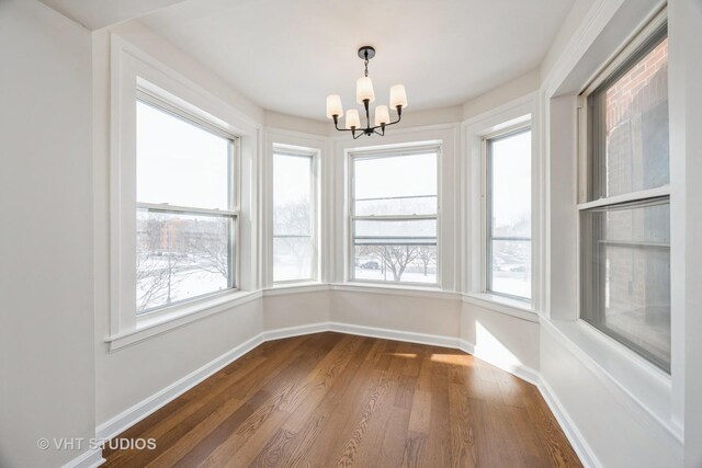 745 S Independence Blvd Unit 3N, Chicago, IL 60624 - unfurnished sunroom featuring a chandelier and plenty of natural light