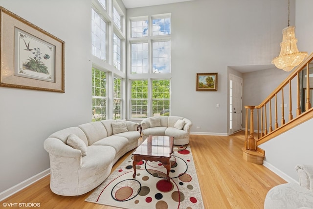 2397 Pebble Beach Ln, Riverwoods, IL 60015 - living room featuring wood finished floors, healthy amount of natural light, stairs, and a high ceiling