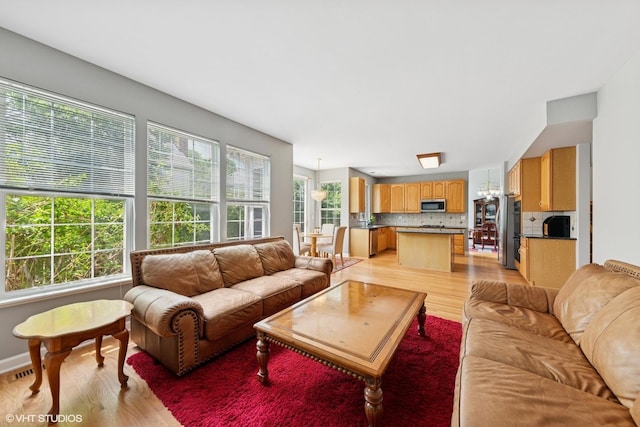 2397 Pebble Beach Ln, Riverwoods, IL 60015 - living area with light wood finished floors and a chandelier