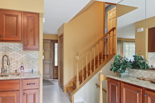 17W455 Concord Pl, Darien, IL 60561 - kitchen featuring tasteful backsplash, light stone countertops, and brown cabinetry