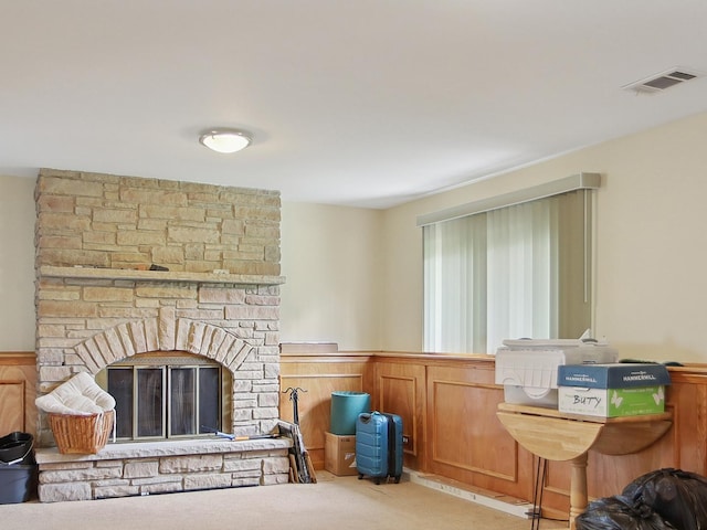 17W455 Concord Pl, Darien, IL 60561 - carpeted living room featuring a wainscoted wall and a stone fireplace