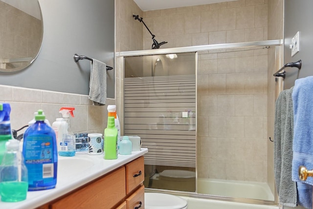 17W455 Concord Pl, Darien, IL 60561 - full bath featuring vanity, bath / shower combo with glass door, radiator heating unit, and tile walls