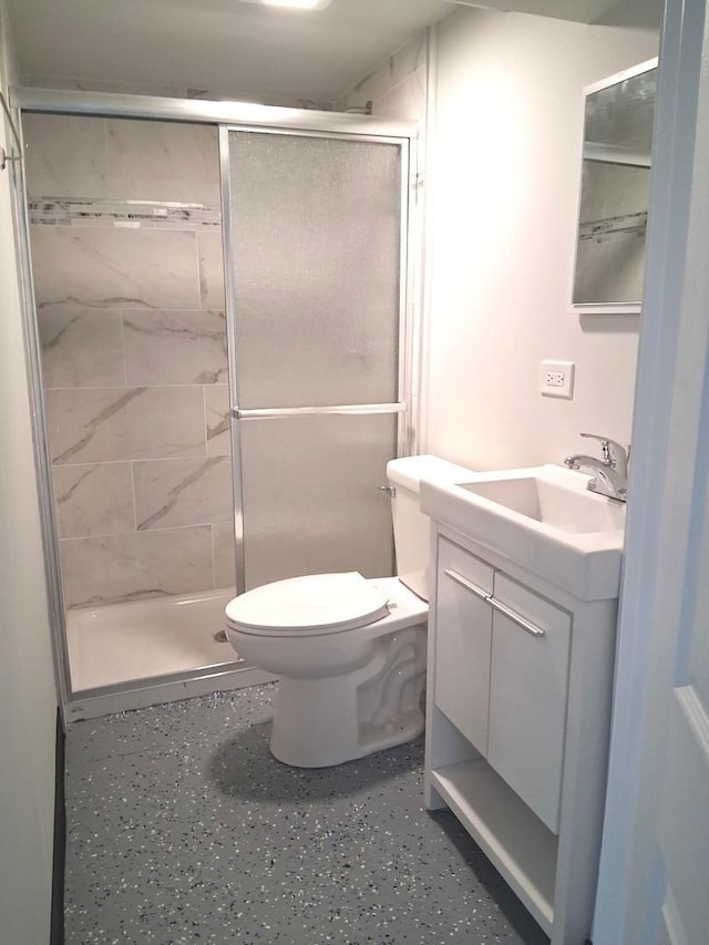 bathroom with vanity and a stall shower