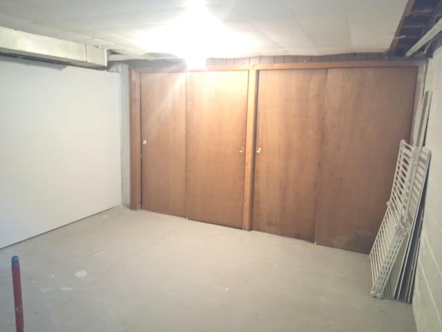 unfinished below grade area featuring radiator heating unit