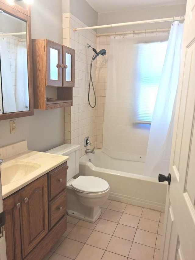 bathroom featuring vanity, shower / tub combo, and tile patterned flooring