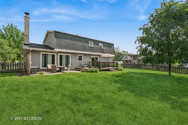 1700 Bolson Dr, Downers Grove, IL 60516 - back of house featuring a fenced backyard, a chimney, a shingled roof, and a wooden deck
