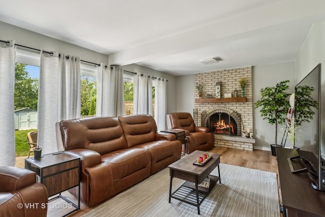 1700 Bolson Dr, Downers Grove, IL 60516 - living area with healthy amount of natural light, wood finished floors, and a brick fireplace