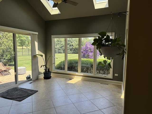 4213 Steam Mill Ct, Oswego, IL 60543 - tiled empty room featuring a skylight, healthy amount of natural light, ceiling fan, and high vaulted ceiling