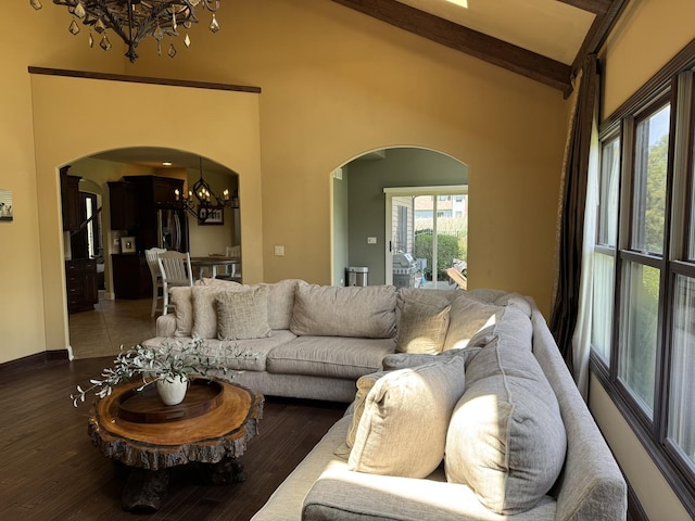 4213 Steam Mill Ct, Oswego, IL 60543 - living area with a chandelier, arched walkways, and wood finished floors