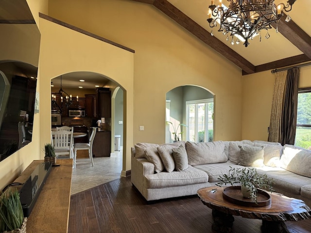 4213 Steam Mill Ct, Oswego, IL 60543 - living room featuring a chandelier, arched walkways, beam ceiling, high vaulted ceiling, and dark wood-style flooring