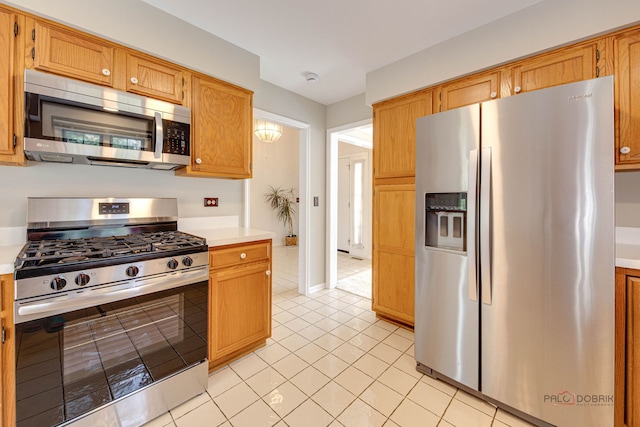 122 Kilchurn Ln, Inverness, IL 60067 - kitchen with stainless steel appliances, light countertops, and light tile patterned flooring
