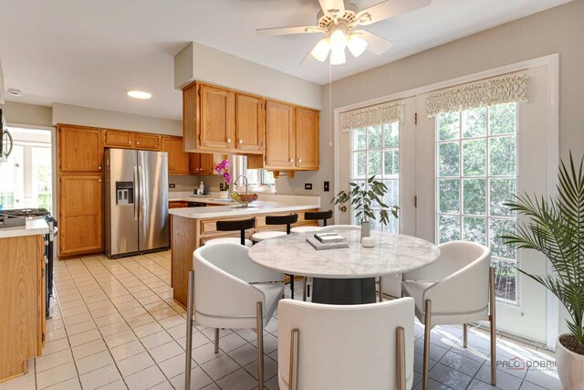 122 Kilchurn Ln, Inverness, IL 60067 - kitchen with appliances with stainless steel finishes, light countertops, ceiling fan, light tile patterned floors, and recessed lighting