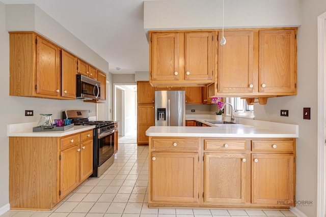 122 Kilchurn Ln, Inverness, IL 60067 - kitchen featuring appliances with stainless steel finishes, a peninsula, light countertops, and light tile patterned floors