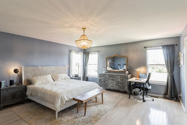 15 Richmond Cir S, Elgin, IL 60177 - bedroom featuring wood finished floors and a chandelier