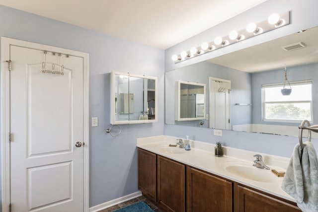 15 Richmond Cir S, Elgin, IL 60177 - bathroom featuring double vanity and baseboards
