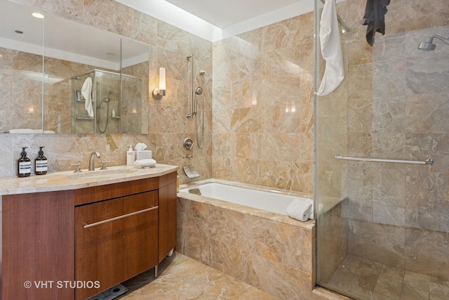 401 N Wabash Ave Unit 30E, Chicago, IL 60611 - bathroom featuring tile walls, vanity, and tiled shower / bath