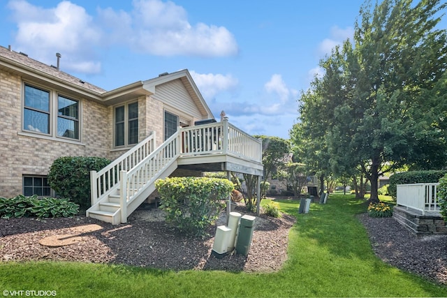 11910 Somerset Rd, Orland Park, IL 60467 - view of home's exterior with a deck, stairway, brick siding, and a lawn