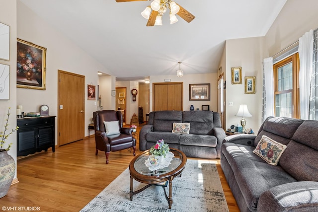 11910 Somerset Rd, Orland Park, IL 60467 - living room featuring light wood-style flooring, vaulted ceiling, and a ceiling fan