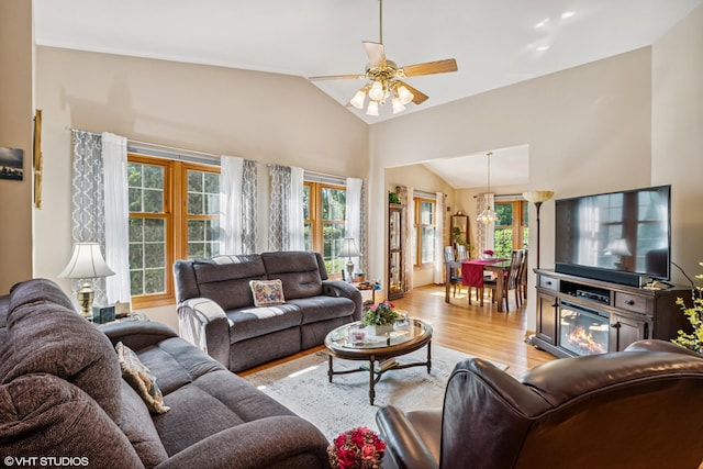 11910 Somerset Rd, Orland Park, IL 60467 - living area featuring lofted ceiling, healthy amount of natural light, light wood-style floors, and ceiling fan
