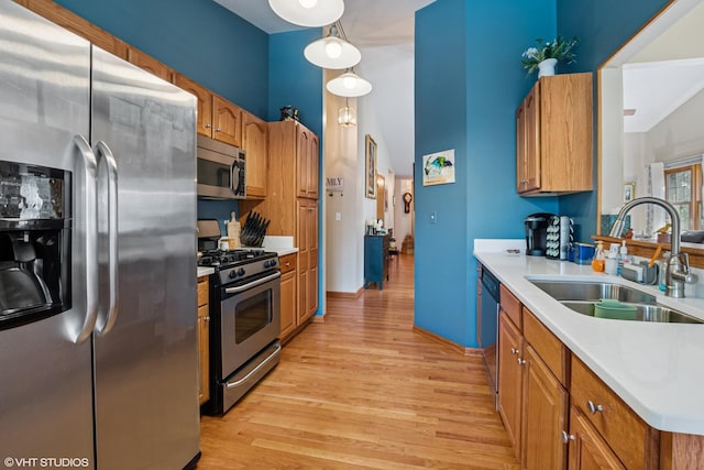 11910 Somerset Rd, Orland Park, IL 60467 - kitchen with appliances with stainless steel finishes, light wood-type flooring, light countertops, and brown cabinets