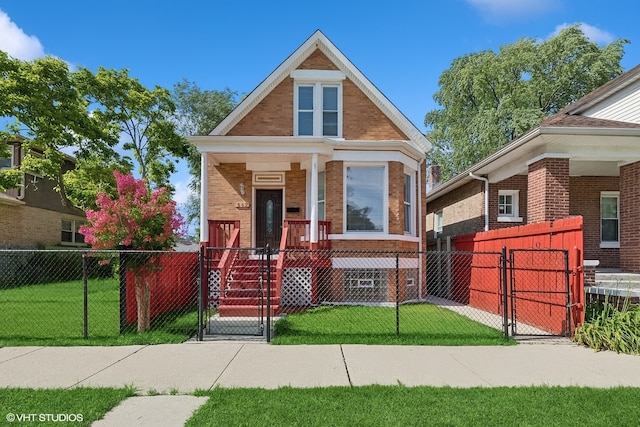 642 E 90th St, Chicago, IL 60619 - view of front of house featuring a gate, brick siding, a fenced front yard, and a porch