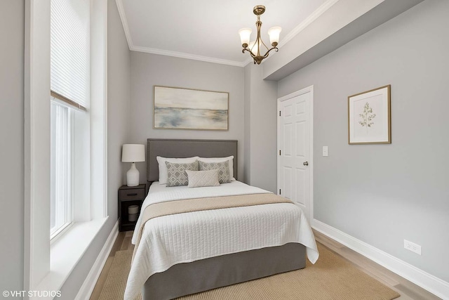 642 E 90th St, Chicago, IL 60619 - bedroom featuring wood finished floors, crown molding, and a chandelier