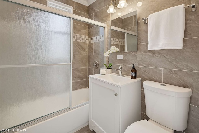 642 E 90th St, Chicago, IL 60619 - full bath with vanity, shower / bath combination with glass door, and tile walls
