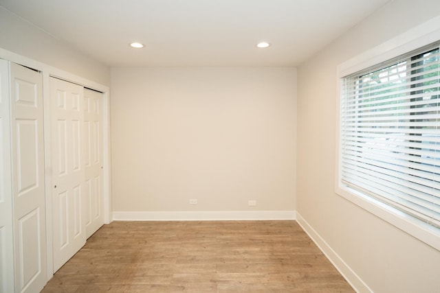4833 W 109th St Unit 103, Oak Lawn, IL 60453 - unfurnished bedroom featuring light wood finished floors, recessed lighting, and a closet