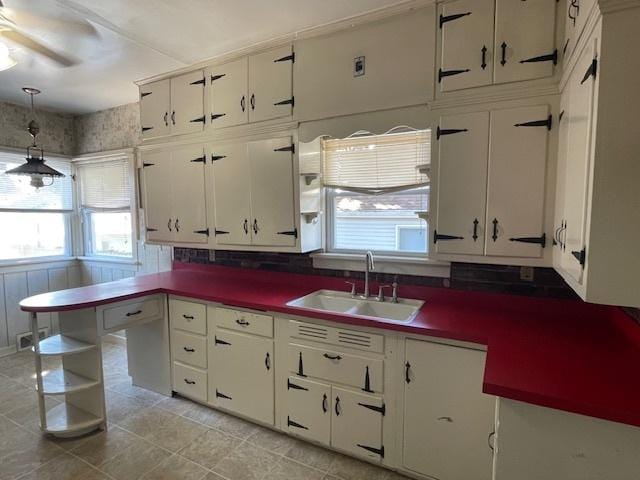 1322 N Prairie Ave, Joliet, IL 60435 - kitchen featuring white cabinets and ceiling fan