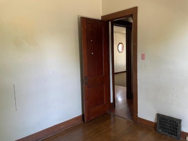 1322 N Prairie Ave, Joliet, IL 60435 - unfurnished room featuring baseboards and wood finished floors