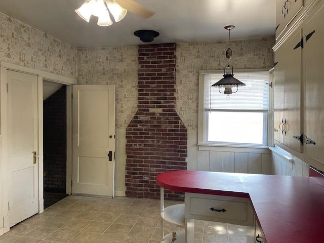 1322 N Prairie Ave, Joliet, IL 60435 - dining area featuring light tile patterned floors and ceiling fan