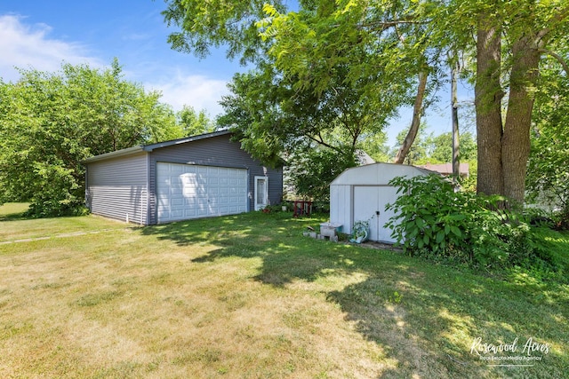 409 E Main St, Peotone, IL 60468 - view of grassy yard featuring a garage and a storage shed