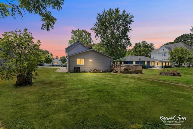 409 E Main St, Peotone, IL 60468 - yard at dusk featuring a wooden deck and a yard
