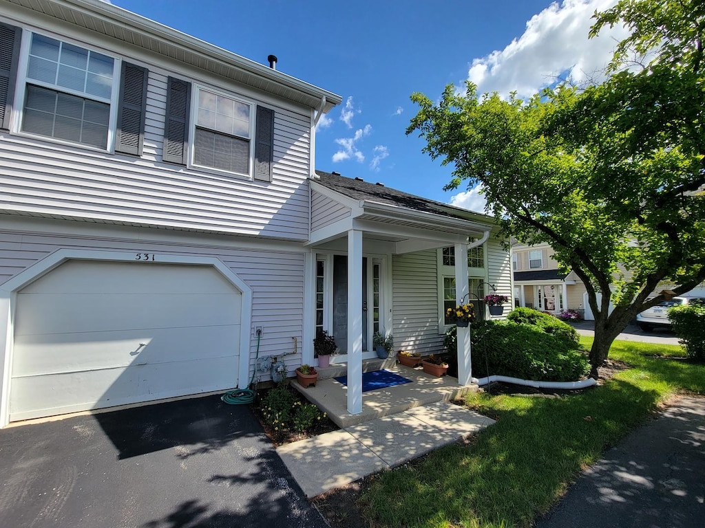 531 E Ave, Streamwood, IL 60107 - view of front of home featuring driveway and an attached garage