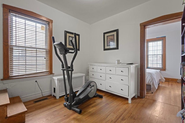 1619 S 61st Ave, Cicero, IL 60804 - exercise room with light wood finished floors and radiator