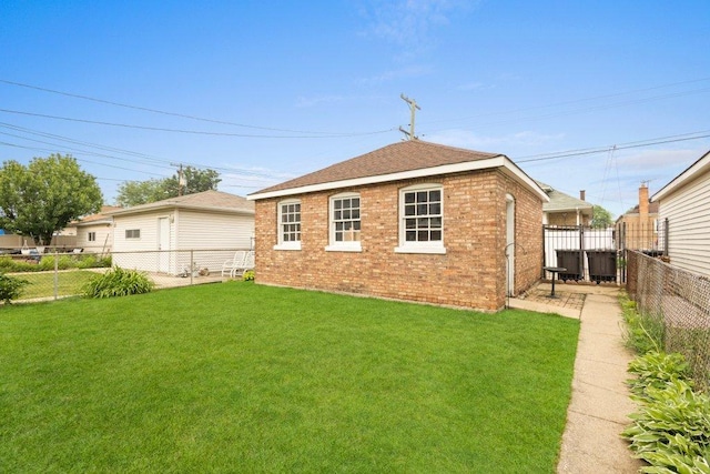 1619 S 61st Ave, Cicero, IL 60804 - back of property with brick siding, a fenced backyard, and roof with shingles