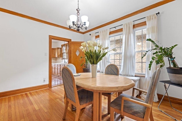 1619 S 61st Ave, Cicero, IL 60804 - dining space featuring a chandelier, light wood-style floors, and crown molding