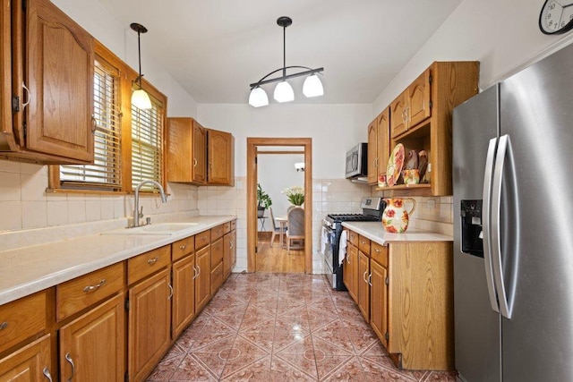 1619 S 61st Ave, Cicero, IL 60804 - kitchen featuring stainless steel appliances, brown cabinetry, light countertops, and decorative backsplash