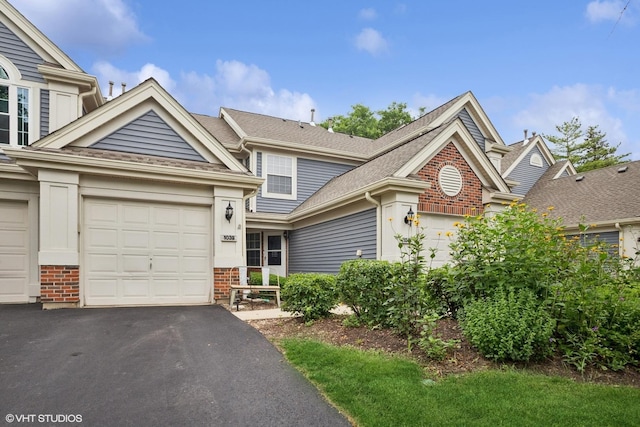 1039 Talbots Ln, Elk Grove Village, IL 60007 - view of front facade with brick siding, asphalt driveway, an attached garage, and a shingled roof